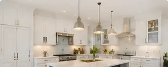 Bright white kitchen with large island and stainless appliances