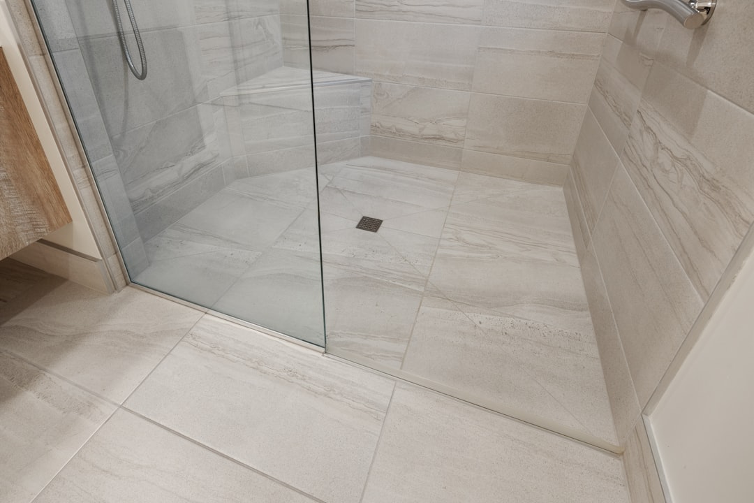 Newly tiled bathroom with level floor and sealed junctions