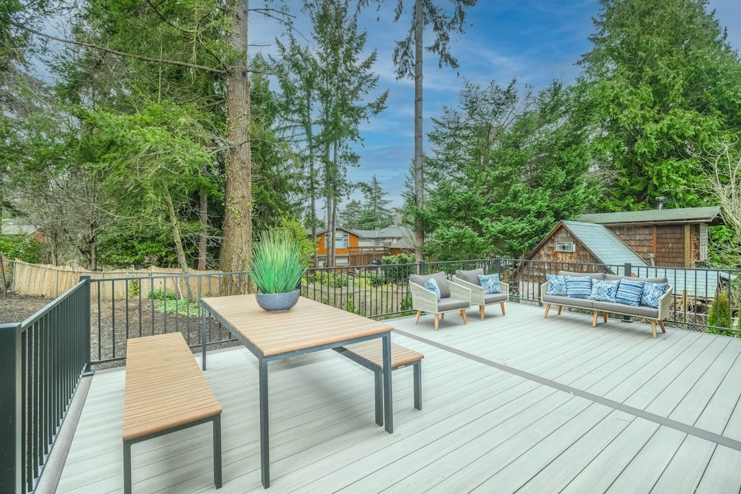 Timber deck built on a raised, ventilated frame in a landscaped garden